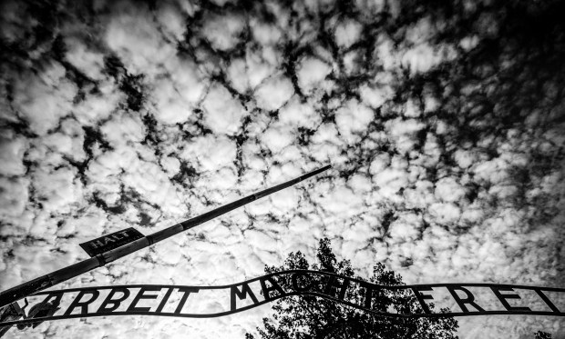 Arbeit macht frei with cloudy sky