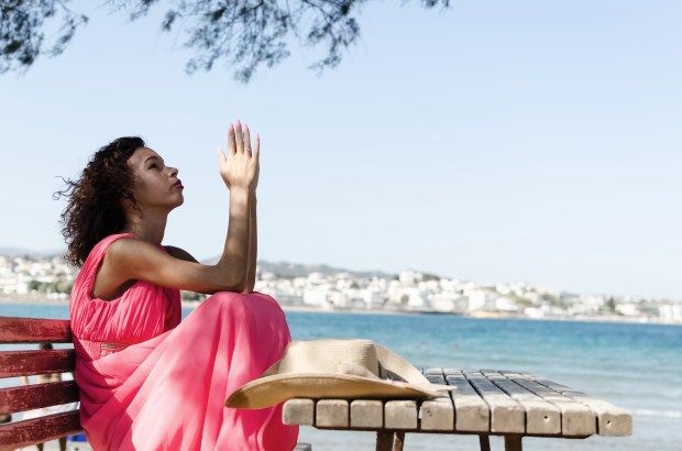 Woman praying God outdoors